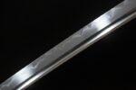 Demon-killing Sword blade hamon detail, displaying unique wavy pattern and forging craftsmanship.