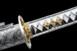 Silver Peony tsuka-ito handle wrap and menuki ornament detail on samurai sword