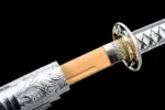 Silver Peony engraved scabbard collar (koiguchi) and blade mouth detail on samurai sword