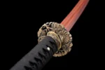 Tang Bohu Dian Qiuxiang tsuba guard front view with ornate brass floral carving and fuchi collar, training samurai sword, wooden samurai sword