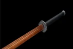 Wooden Embroidered Spring Knife fuchi collar and wooden blade-mouth junction detail in black alloy, training samurai sword, wooden samurai sword