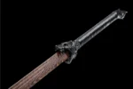 Tang Horizontal Sword Type B dragon-head scabbard carving at handle junction detail.