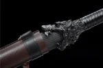 Tang Horizontal Sword Type B scabbard mouth featuring intricate dragon-head carving and black leather wrap.