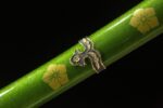 Detailed view of the Blue Water Knife’s scabbard and its decorative fittings.