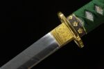 Decorative guard of the Blue Water Knife, highlighting its gold accents and intricate design.