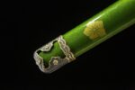 Close-up of the scabbard fitting of the Blue Water Knife, with intricate metalwork and leaf motifs.
