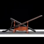Tang Horizontal Sword Type B crossed display of two swords on a wooden stand.