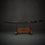 Dark Plum katana displayed on a wooden stand with detailed fittings