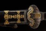 Great Ming Yongle sword, close-up of the intricate carvings and patterns on the back of the guard