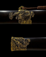 Qilin Sword, showcasing the detailed carving patterns on the scabbard's end and middle sections.