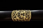 Imperial Sword hilt, detailed carving of dragon motifs, showcasing craftsmanship.