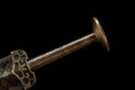 Han Xin Sword, a close-up of the pommel and end of the handle, showing the circular ribbed texture on the handle.