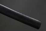 Dark plum katana, close-up of the end of the black scabbard
