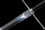 Lightweight European sword, a close-up of the connection between the handguard and handle, showing how the metal guard, handle, and blade are tightly joined, highlighting the manufacturing craftsmanship.