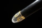 Beast King Sword scabbard end, highlighting the silver and gold filigree.