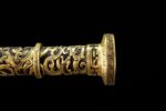 Imperial Sword, close-up of the hilt's end, showing detailed brass ornamentation and fine carving.