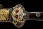 Great Ming Yongle sword, close-up of the elaborate carvings and ornamentation on the front of the guard