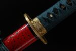 Red Night Sword handle base and upper scabbard joint, showing golden components and red lacquer