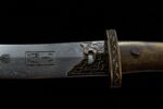 Mongolian knife blade and guard, close-up showing engraved details at the joint