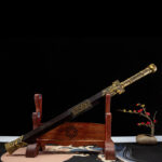 Dragon God Sword, angled view, showing ornate scabbard, brass fittings, and detailed hilt for a luxurious feel.