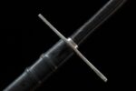 Lightweight European sword, a close-up of the cruciform guard and handle, highlighting the silver guard for effective protection.