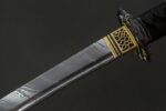Blade of Dark Plum katana with visible Damascus pattern