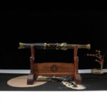 Longming Sword in scabbard on a wooden stand, showing its complete form and decorations.