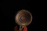 Han Xin Sword, a top-down close-up of the pommel, showcasing its beautiful concentric circular swirling patterns.