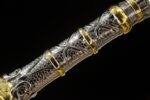 Beast King Sword hilt detail, showing the exquisite relief carvings and ornaments.