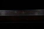 Qin Wang Sword scabbard, showing its smooth black lacquer finish and simple lines.
