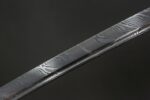 Side view of Dark Plum katana with brass fittings