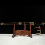 Qilin Sword, a full panoramic view of the blade and scabbard, highlighting the elegant hilt and accessories.